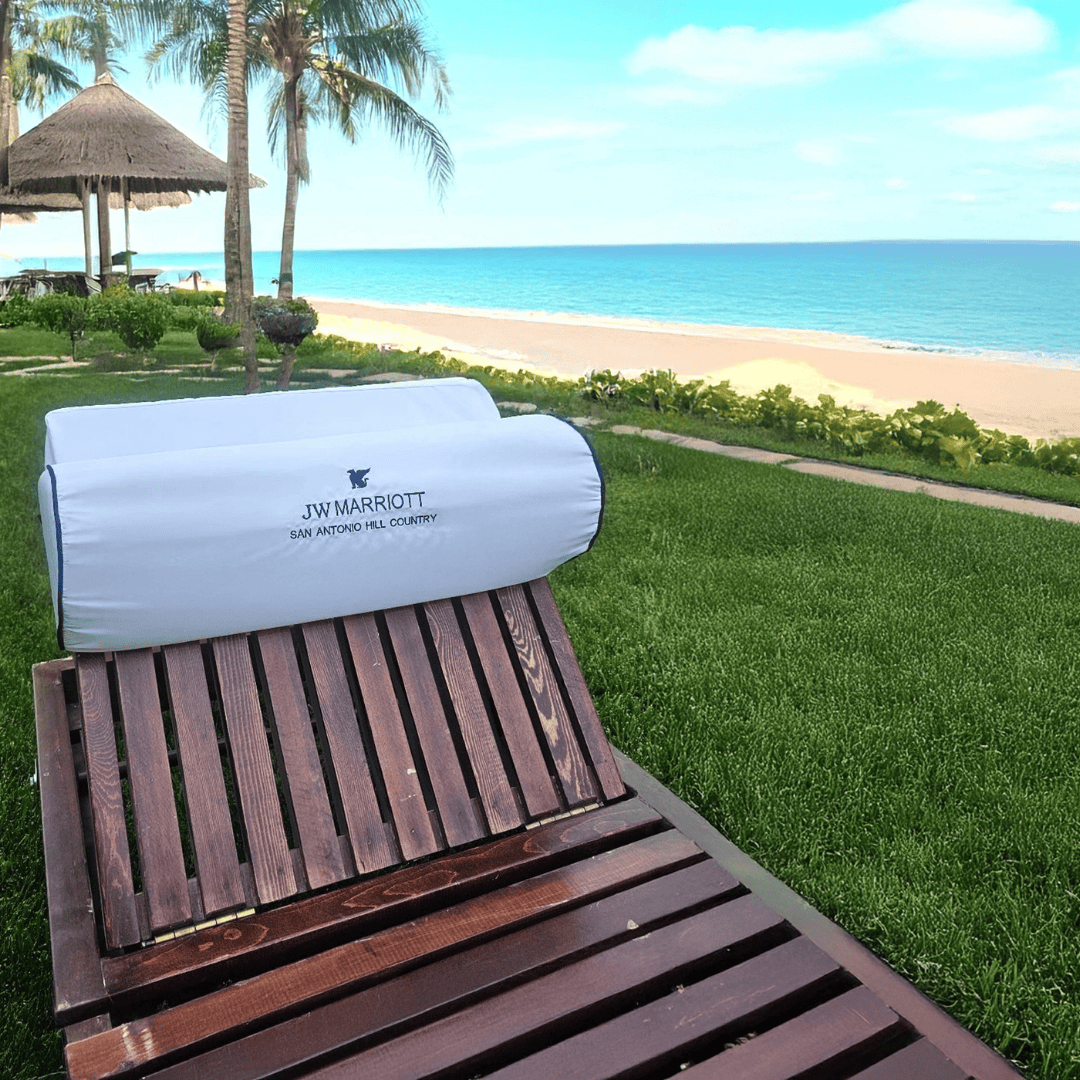 Custom embroidered hotel headrest pillow for resort lounge chairs and beach hospitality